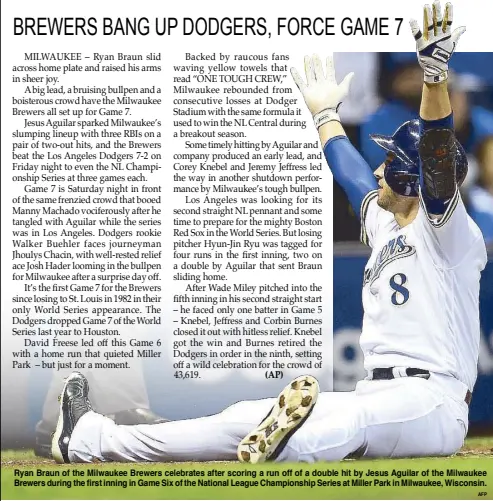  ?? AFP ?? Ryan Braun of the Milwaukee Brewers celebrates after scoring a run off of a double hit by Jesus Aguilar of the Milwaukee Brewers during the first inning in Game Six of the National League Championsh­ip Series at Miller Park in Milwaukee, Wisconsin.