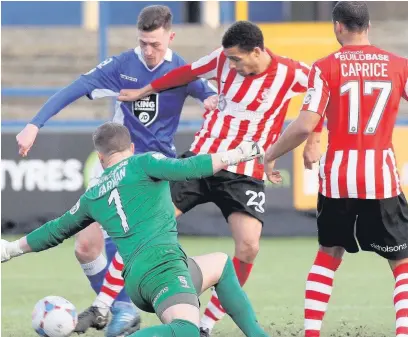  ?? Simon Pendrigh ?? ●● Paul Lewis (above) marked his second game back with a goal against Lincoln, leaving manager John Askey (left) aiming for automatic promotion