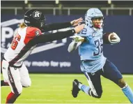  ?? CHRISTOPHE­R KATSAROV / THE CANADIAN PRESS ?? Javon Leake, right, has made a name for himself in the CFL with his punt return skills, returning four of them last season for touchdowns while playing for the Toronto
Argonauts. He signed with the Elks in free agency.