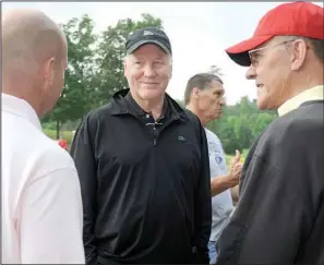  ??  ?? CHAT WITH CLIFF: Former Dallas Cowboys All- Pro free safety Cliff Harris, center, talks with Biff Beale, left, of Austin, Texas, and his father, Chuck Beale, of Hot Springs Village, before the Fellowship of Christian Athletes golf tournament Saturday...