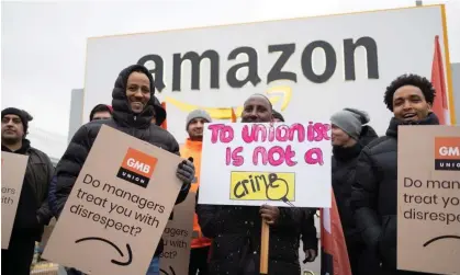  ?? ?? Workers on strike outside an Amazon warehouse in Coventry in January 2023. Photograph: Graeme Robertson/The Guardian