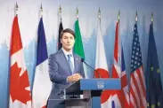  ?? COLE BURSTON/BLOOMBERG ?? Canadian Prime Minister Justin Trudeau speaks during the closing press conference of the G-7 Summit in La Malbaie, Quebec, on Saturday.