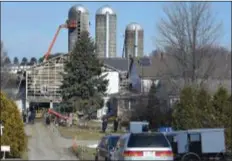  ?? PETE BANNAN - MEDIANEWS GROUP ?? Amish workers and their neighbors, rebuild a dairy barn which was destroyed in a devastatin­g fire early Wednesday morning.