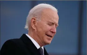  ?? (AP/Evan Vucci) ?? President-elect Joe Biden tears up Tuesday as he speaks at the National Guard/Reserve Center in New Castle, Del., named after his late son, Beau Biden, as he pays tribute to his home state before departing for Washington. Paraphrasi­ng an adage from Irish writer James Joyce, Biden said: “Excuse the emotion. But when I die, Delaware will be written on my heart.”