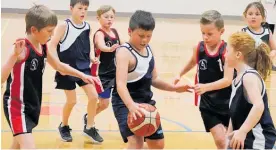  ??  ?? Action from the Horowhenua Primary School Basketball competitio­n at Levin Showground­s last week.