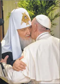  ?? ASSOCIATED PRESS ?? The head of the Russian Orthodox Church, Patriarch Kirill, kisses Pope Francis as they meet at the airport in Havana. This is the firstever papal meeting with the head of the Russian Orthodox Church.