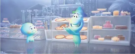  ?? PIXAR ?? Joe, voiced by Jamie Foxx, left, tries to educate 22, Tina Fey, on the joys of pizza in “Soul.”