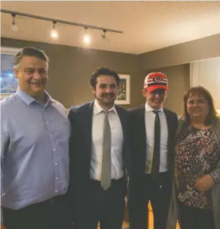  ??  ?? Winnipeg native Seth Jarvis, wearing the Hurricanes cap, celebrates with dad Ray, brother Kayden and mom Tracey after Carolina selected him 13th overall back in October.