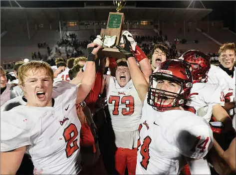  ?? PAUL DICICCO — FOR THE NEWS-HERALD ?? The Chardon football team celebrates after it defeated Columbus DeSales to win the Division III state championsh­ip.