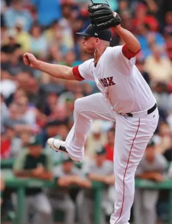  ?? STAFF PHOTOS BY MATT WEST ?? WHAT A RELIEF: Addison Reed gets a strikeout to end the seventh inning, while Craig Kimbrel later came in to finish off the Sox’ win.