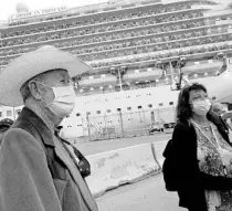  ?? JOE CAVARETTA/AP ?? Passengers disembark from the Caribbean Princess at Port Everglades in Fort Lauderdale on March 11. Mask wearing and numerous other health protocols will be in place when federal health officials allow cruises to resume from U.S. ports sometime later this year.