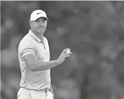  ?? SAM GREENWOOD/GETTY IMAGES ?? PGA Championsh­ip leader Brooks Koepka acknowledg­es the crowd during the third round Saturday in St Louis.