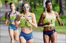  ?? Times Union archive ?? Elaina Tabb (2) of Watertown, Mass., and Diane Nukuri of Flagstaff, Ariz., lead the pack through Washington Park during the 2019 race.