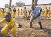  ?? ANDREW RENNEISEN FOR THE NEW YORK TIMES ?? Africans are getting less exercise as they trade farming for city life. A physical education class in Nairobi.