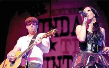  ??  ?? Keifer and ShawnaThom­pson, known as country duoThompso­n Square, perform at a music festival in Columbia, Madison. — WP-Bloomberg photo