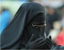  ?? (Fayez Nureldine/AFP via Getty Images) ?? A NIQAB-CLAD woman prays in Cairo.