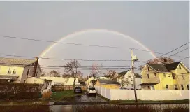  ?? ?? A double rainbow stretches across the sky in Norwalk on Thursday. It could reportedly be seen from both the Merritt Parkway and Interstate 95. Claire K. Racine/Hearst Connecticu­t Media