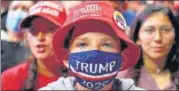  ?? AFP ?? A young supporter wears a Trump 2020 mask at the Tulsa rally. n