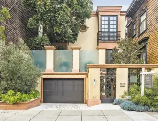  ??  ?? Left: 2440 Vallejo St. in Pacific Heights is a five-bedroom smart home with a Savant system available for $9.95 million. Below: A floating gas fireplace warms the sunken family room with hardwood flooring.