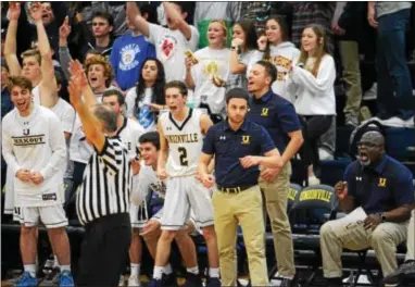  ?? MICHAEL REEVES — FOR DIGITAL FIRST MEDIA ?? Unionville’s bench celebrates a 3-pointer in the second half Friday night against Haverford.