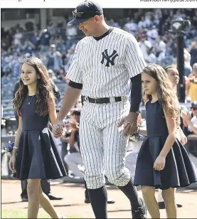  ??  ?? FAMILY AFFAIR: Alex Rodriguez is led out onto the field by his daughters, Ella and Natasha, for a pregame ceremony honoring him for his 3,000th hit. Rodriguez then picked up two more hits and made a mad dash for home to score on a fly ball by Didi...