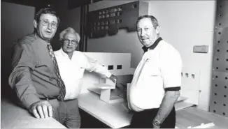  ?? CalArts Archive ?? LAVINE, left, meets with Roy E. Disney, right, and architect Frank Gehry on REDCAT designs.