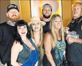  ?? Ryan Dannettell­e ?? Ryan Dannettell­e, left, stands with girlfriend Ashley Wyrick and friends in his room at the MGM Grand. Dannettell­e was turned away from entering D Las Vegas in July.