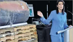  ??  ?? CLIFF OWEN/AP US Ambassador to the UN Nikki Haley gestures as she speaks in front of what she claimed were recovered segments of an Iranian rocket during a press briefing at Joint Base Anacostia-bolling in Washington, DC, on December 14, 2017.