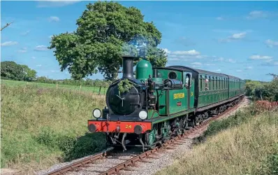  ?? ?? No. W24 Calbourne displays a wreath for The Queen during the Isle of Wight Steam Railway gala on September 17. JOHN FAULKNER/IOWSR