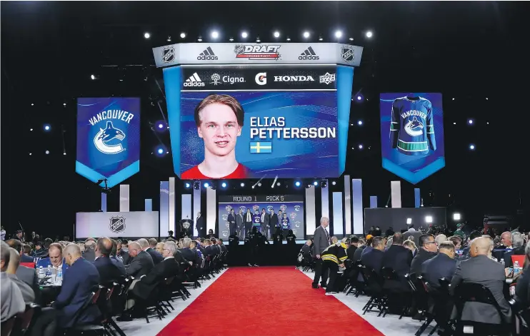  ?? — GETTY IMAGES ?? Elias Pettersson of Sweden is selected fifth overall by the Vancouver Canucks during the 2017 NHL Entry Draft at the United Center on Friday in Chicago.