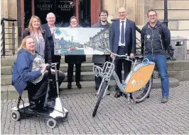  ??  ?? Celebratio­n Marking the award of the grant are residents Amanda Hennan and Sally Shaw, Councillor Thomson, Stirling Council officials Anne Clark, Andrew Adam and Jonathan Padmore, and Graham McQueen from Cycle Hub.