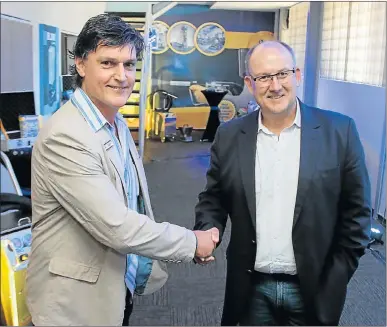  ?? Picture: BRIAN WITBOOI ?? WELCOME TO THE HOTSPOT: Deon Roux, of Dry Ice Internatio­nal, with mayor Athol Trollip at the official opening of the dry ice business in Kwaford Road, New Brighton