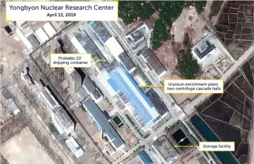  ??  ?? A view of what researcher­s of Beyond Parallel, a CSIS project, describe as a probably 20-foot shipping container near the uranium enrichment plant at the Yongbyon Nuclear Research Center in North Pyongan Province, North Korea, in this commercial satellite image. — Reuters photo