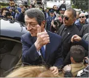  ?? PETROS KARADJIAS / AP ?? Cypriot President Nicos Anastasiad­es gestures to supporters after voting in the presidenti­al election in southern coastal city of Limassol on Sunday. He was reelected by a wide margin.