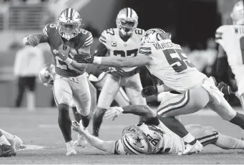  ?? TONY AVELAR AP ?? 49ers running back Elijah Mitchell rushes against the Cowboys during San Francisco’s 19-12 victory in their divisional round game on Sunday night. The 49ers will take on the Eagles on Sunday for a chance to go to the Super Bowl.