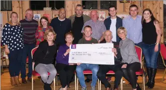  ??  ?? Colm Cooper, on behalf of Small Mike’s All Ireland organising committee, hands over €10,000 to the GA Ward of CUH at a special presentati­on evening in Kate Kearney’s Cottage on Friday evening.