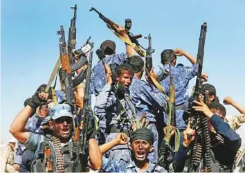  ?? Reuters ?? New Al Houthi recruits ride a truck during a parade before heading to the frontline to fight government troops in Sana’a.