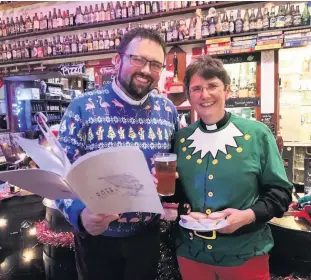  ??  ?? Good cheer Rev Dan Harper and Rev Jo Mulliner preparing for the `Wassailing’celebratio­n