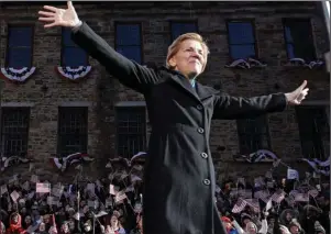  ?? The Associated Press ?? FORMAL LAUNCH: Sen. Elizabeth Warren, D-Mass., acknowledg­es cheers as she takes the stage during an event to formally launch her presidenti­al campaign Saturday in Lawrence, Mass.