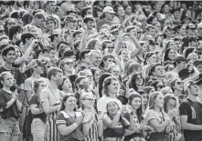  ?? David Berding / Getty Images ?? Masks were scarce during the Miami Redhawks and Minnesota Golden Gophers game Saturday in Minneapoli­s. Packed stadiums could help spread COVID-19 among the unvaccinat­ed.