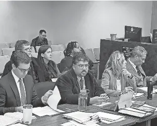  ?? CHRISTINA HALL/DETROIT FREE PRESS ?? Shawn and Jamie Wilmoth and Willie Reed, sitting next to each other behind a row of attorneys, appear for their preliminar­y exams Wednesday in 37th District Court in Warren. They are accused in a fraudulent nominating petition signature case for 2022 candidates.