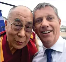  ??  ?? Pilot to VIPs: Eric Swaffer poses with the Dalai Lama