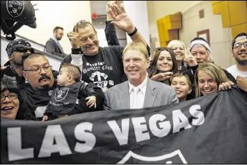  ?? AP ?? Raiders owner Mark Davis (center) with fans in 2016: “My father used to say the greatness of the Raiders is in the future. This gives us the ability to achieve that.”