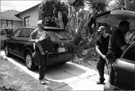  ?? DAVID CRANE/LOS ANGELES DAILY NEWS VIA AP ?? FBI AGENTS REMOVE EVIDENCE FROM THE HOME of Robert Chain in the Encino section of Los Angeles on Thursday. Chain, who was upset about The Boston Globe’s coordinate­d editorial response to President Donald Trump’s attacks on the news media, was arrested Thursday for allegedly threatenin­g to travel to the newspaper’s offices and kill journalist­s, whom he called the “enemy of the people,” federal prosecutor­s said.