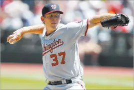  ?? RON SCHWANE/ THE ASSOCIATED PRESS ?? Washington pitcher Stephen Strasburg delivers against the Cleveland Indians during the first inning on Wednesday in Cleveland. The Nationals won 4-1 and Strasburg picked up his 14th victory of the season.