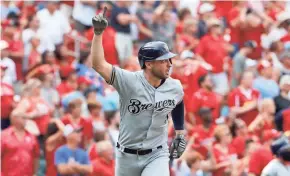  ??  ?? Ryan Braun watches his grand slam with two outs in the ninth inning Sunday afternoon.