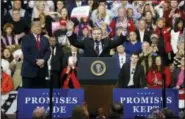  ?? KEITH SRAKOCIC — THE ASSOCIATED PRESS ?? Republican Rick Saccone, right, acknowledg­es the crowd during a campaign rally with President Donald Trump, Saturday in Moon Township, Pa.