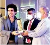  ?? ?? HTS Holdings Chairman and MD Rathnasiri Priyantha receives awards