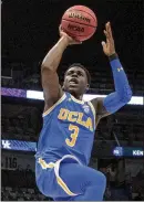  ?? SCOTT THRELKELD / ASSOCIATED PRESS ?? UCLA guard Aaron Holiday scored 20 points to help the Bruins to an upset of
No. 7 Kentucky Saturday afternoon in New Orleans.