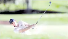  ?? - AFP photo ?? Henley hits out of a bunker on the fifteen fairway during the third round of the CJ Cup @ Shadow Creek in Las Vegas, Nevada.